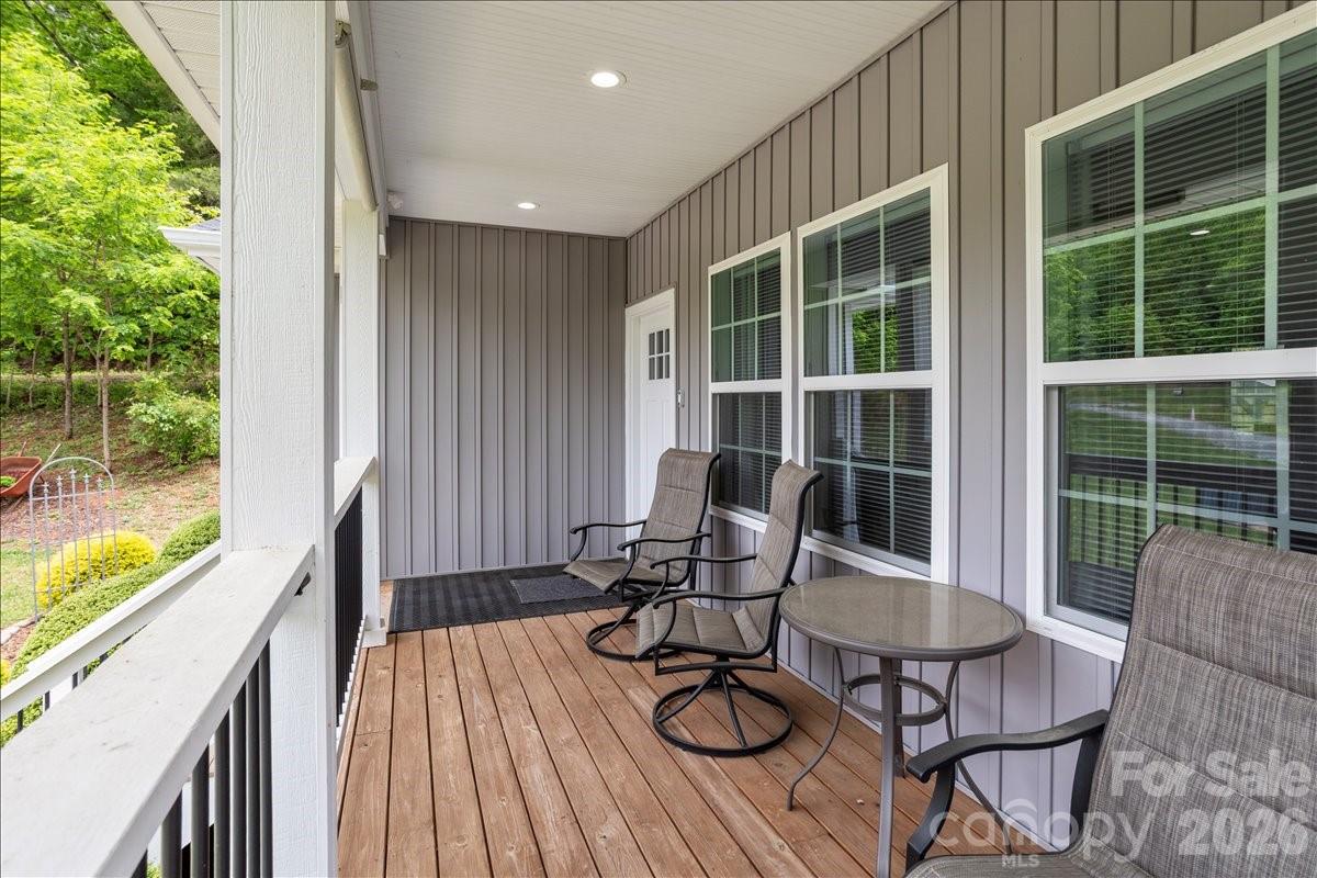 24 Mink Farm Road Leicester, NC 28748 - Photo 4 of 35 a view of balcony with chairs and wooden floor