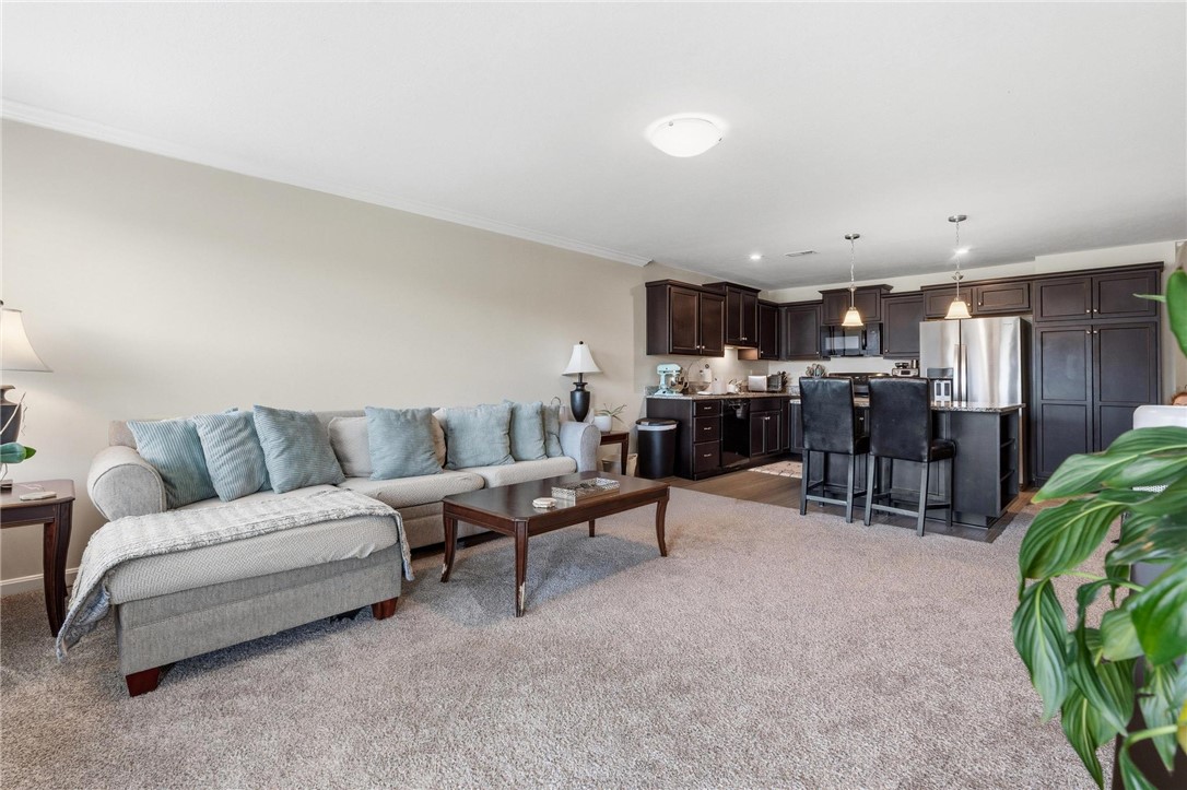 141 Old Pond Road Springboro, OH 45066 - Photo 6 of 20 An inviting open-concept space features a comfortable living area seamlessly flowing into a modern kitchen.