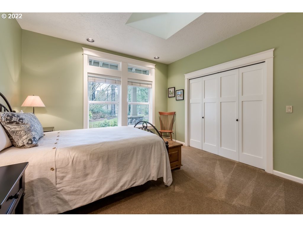 13831 South Carus Road Oregon City, OR 97045 - Photo 4 of 32 a bedroom with a bed and a window