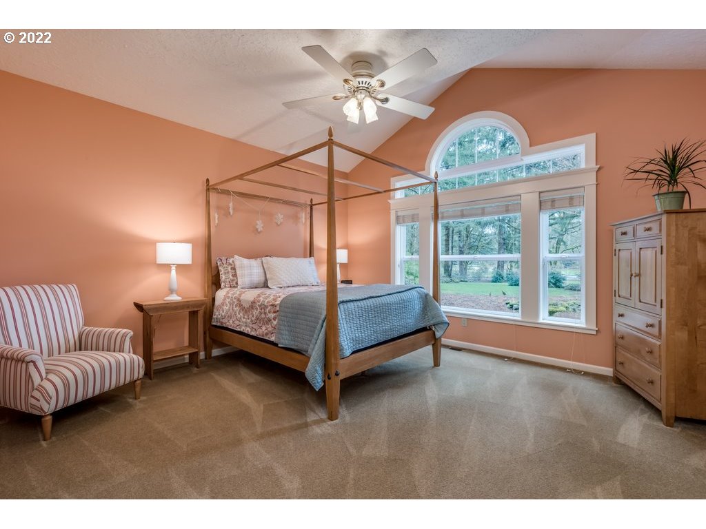 13831 South Carus Road Oregon City, OR 97045 - Photo 5 of 32 a bedroom with a bed couch and window