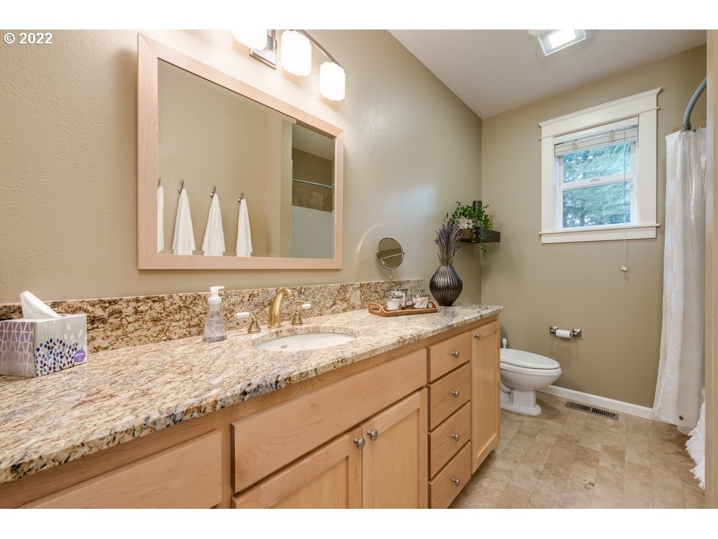 13831 South Carus Road Oregon City, OR 97045 - Photo 6 of 32 a bathroom with a granite countertop sink mirror and a toilet