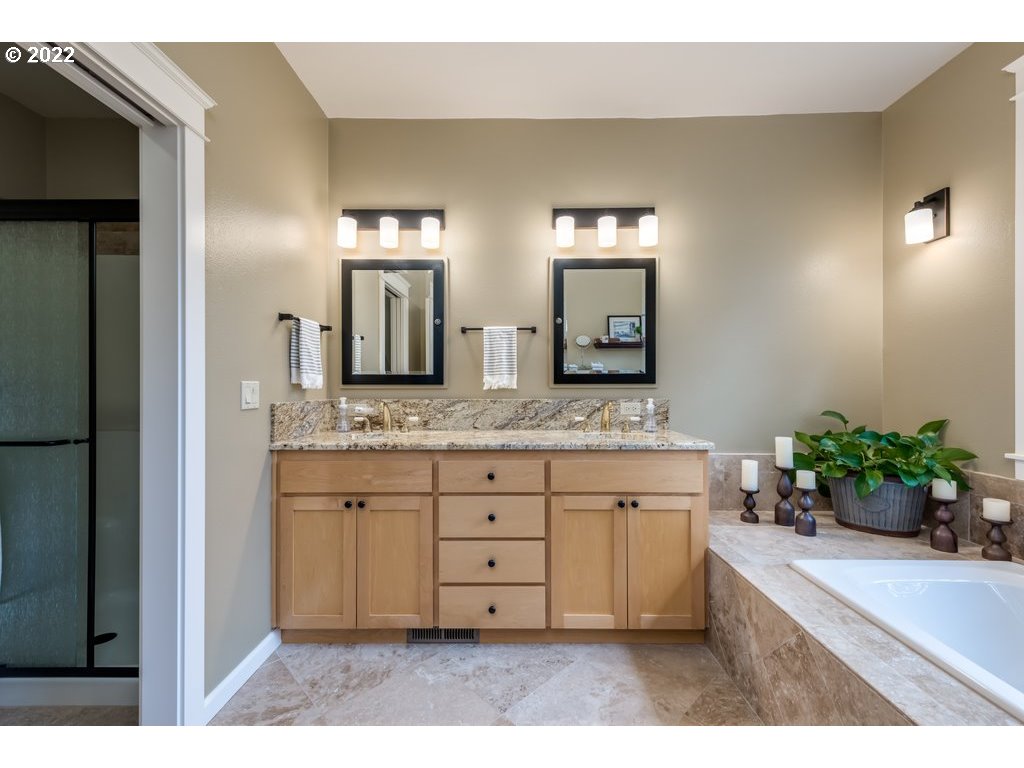 13831 South Carus Road Oregon City, OR 97045 - Photo 8 of 32 a bathroom with a granite countertop sink and a mirror