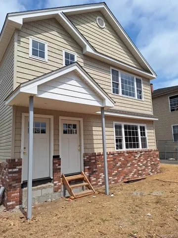 a front view of a house with street