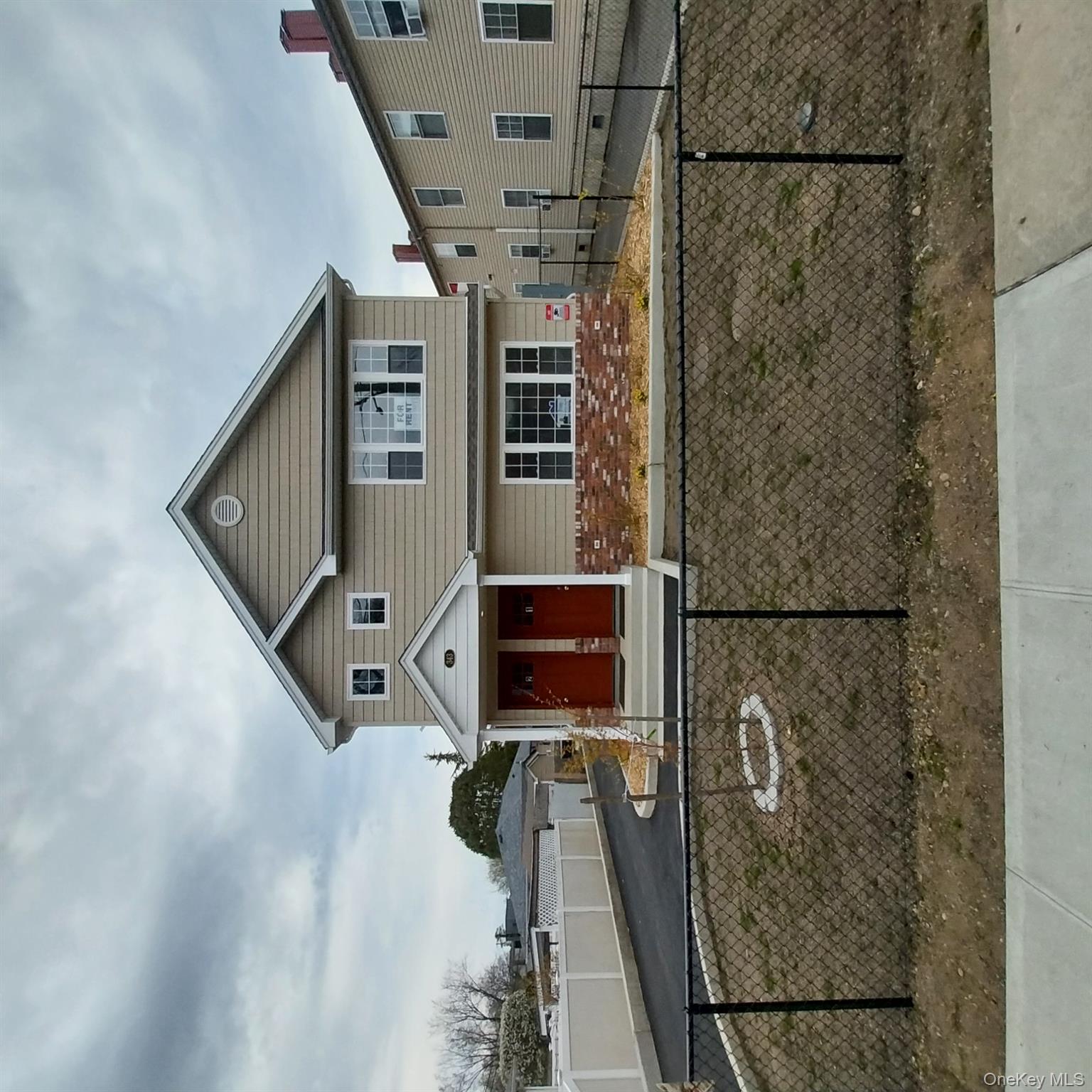 343 Jackson Street, Unit 3 Hempstead, NY 11550 - Photo 3 of 23 front view of a house with a yard