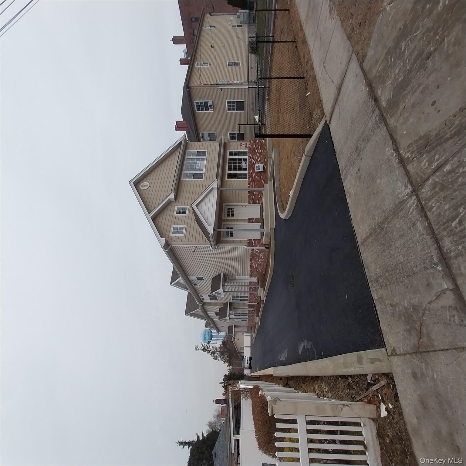 343 Jackson Street, Unit 3 Hempstead, NY 11550 - Photo 4 of 23 a front view of a house with yard