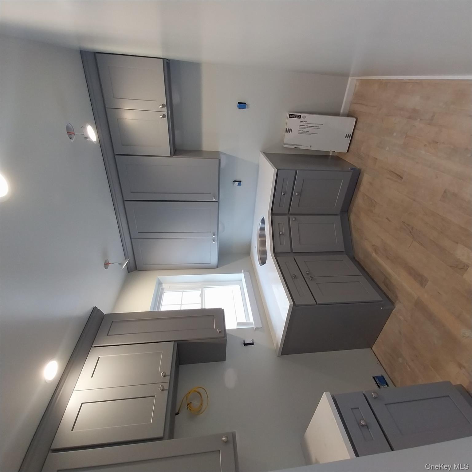 343 Jackson Street, Unit 3 Hempstead, NY 11550 - Photo 5 of 23 a kitchen that has a sink and a stove in it