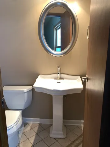 a bathroom with a sink and mirror
