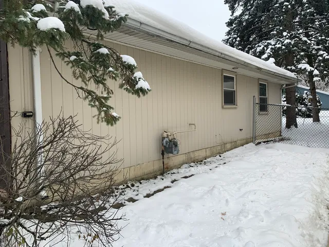 a view of a house with a snow on the wall