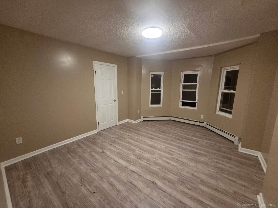 63 Seyms Street Hartford, CT 06120 - Photo 12 of 12 a view of a livingroom with wooden floor and window