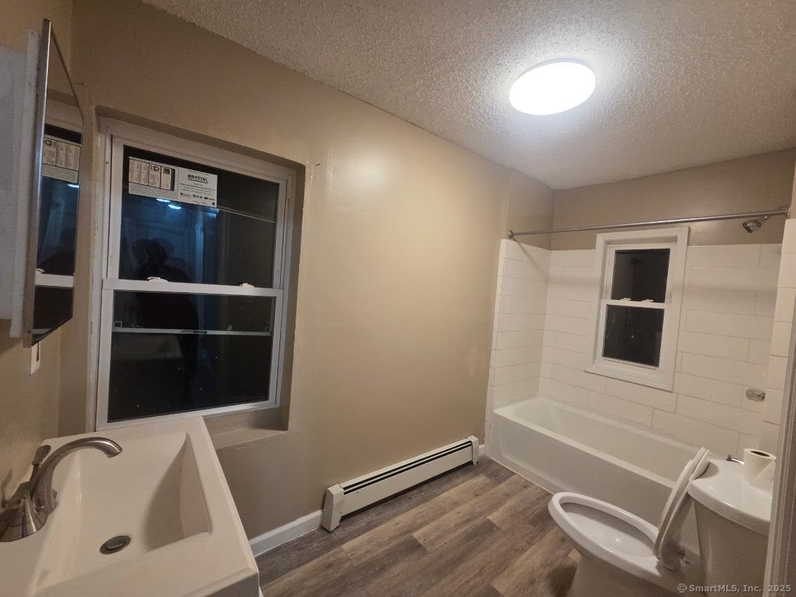 63 Seyms Street Hartford, CT 06120 - Photo 7 of 12 a bathroom with a sink and a tub