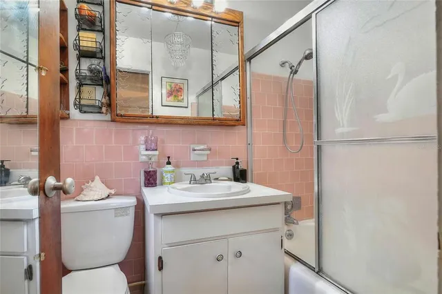 a view of a livingroom with furniture and a flat screen tv