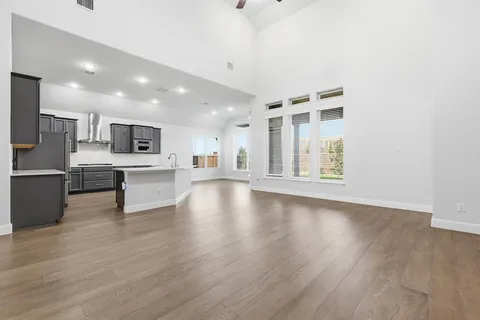 a view of kitchen with wooden floor and window