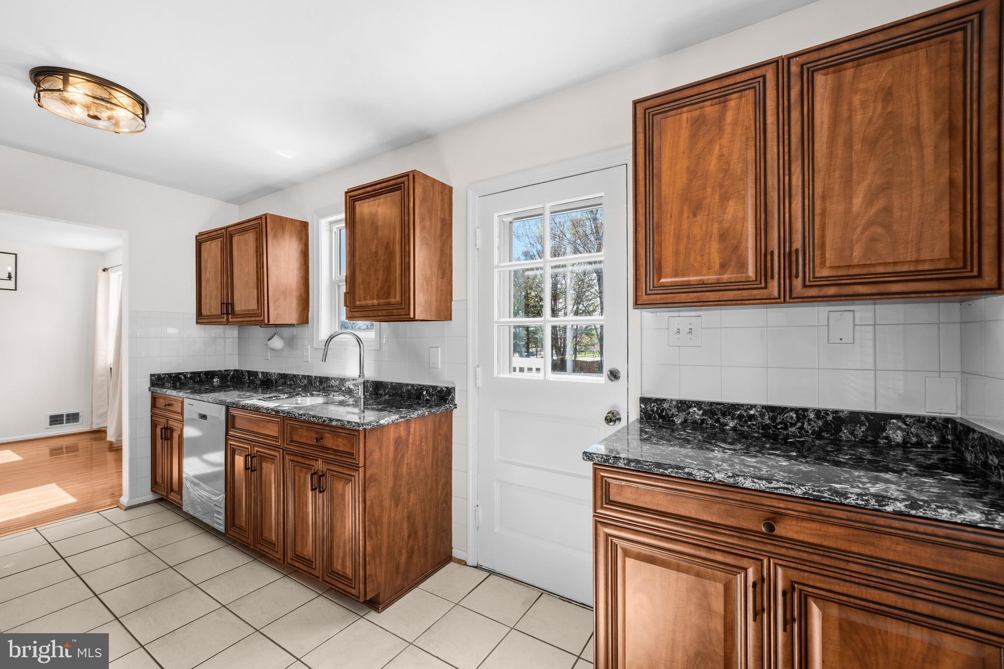 5 Coatbridge Court Olney, MD 20832 - Photo 13 of 49 a kitchen with stainless steel appliances granite countertop a stove sink and cabinets