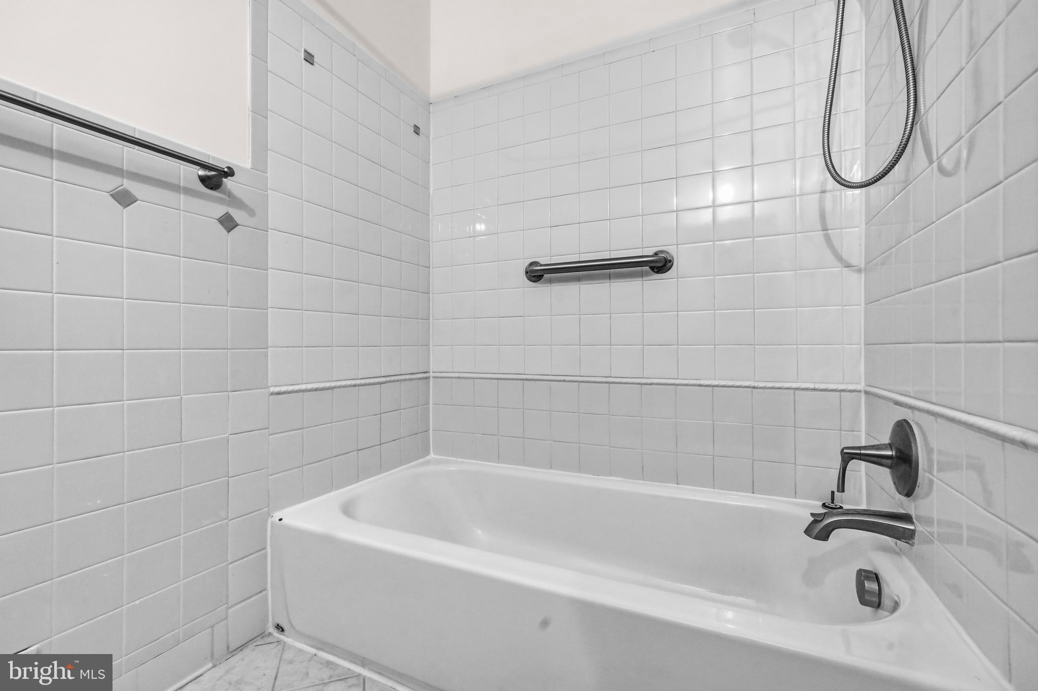 5 Coatbridge Court Olney, MD 20832 - Photo 26 of 49 a bathroom with a bath tub with a shower
