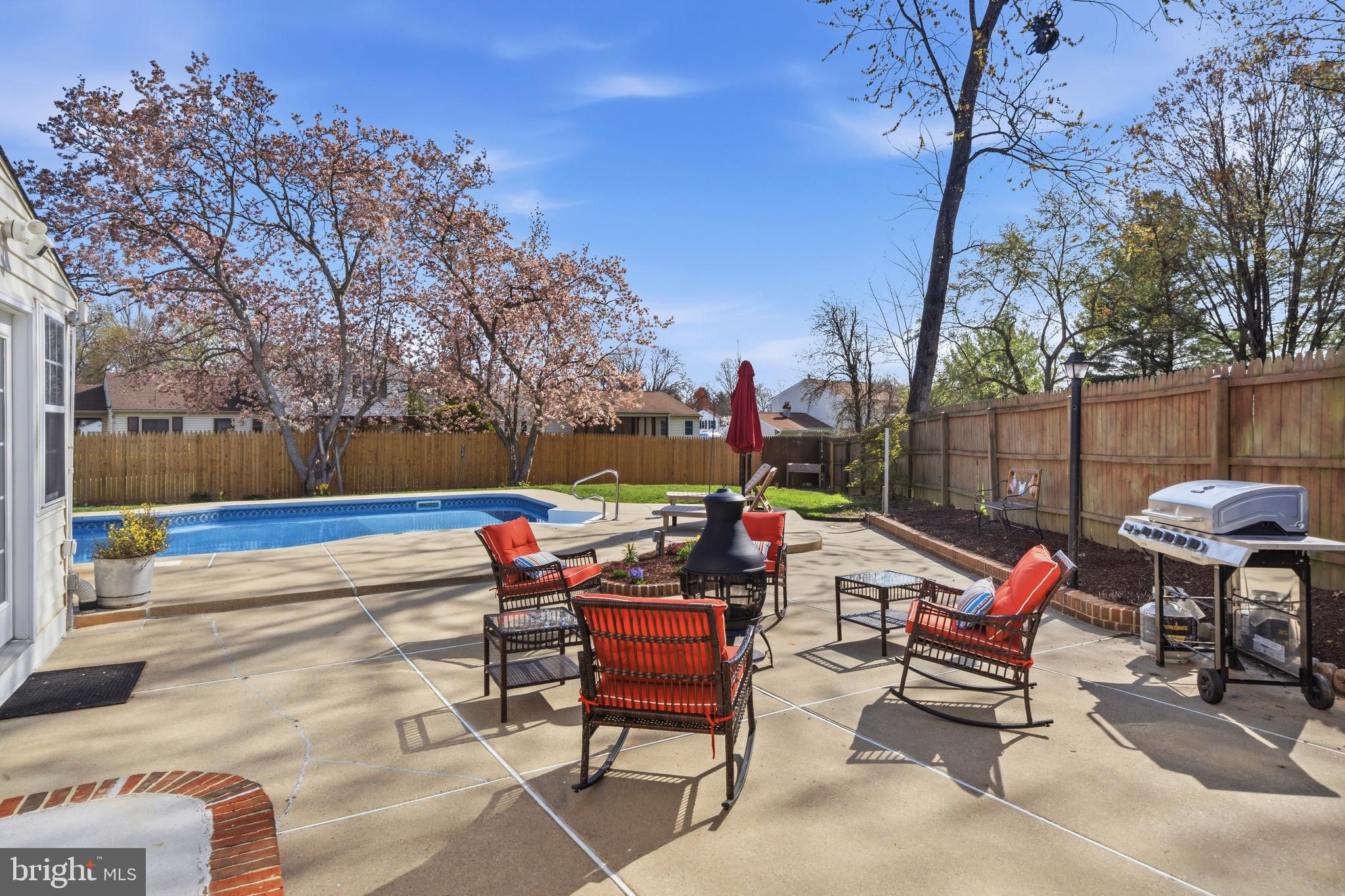5 Coatbridge Court Olney, MD 20832 - Photo 44 of 49 a backyard of a house with barbeque oven table and chairs