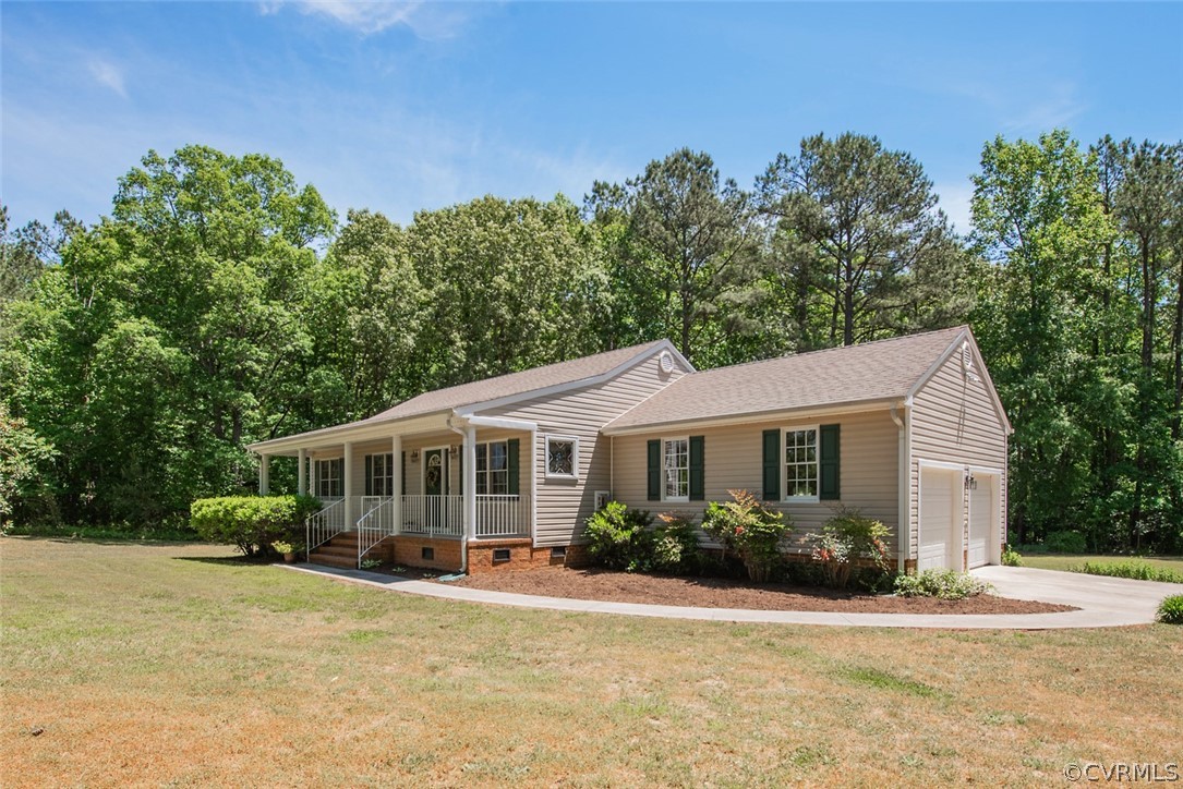 21417 Courthouse Road Dinwiddie, VA 23841 - Photo 1 of 50 a front view of a house with a yard and trees