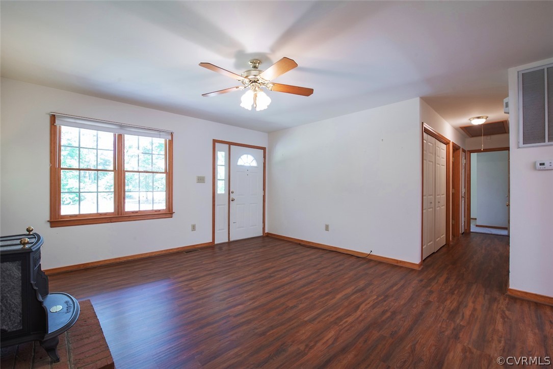 21417 Courthouse Road Dinwiddie, VA 23841 - Photo 11 of 50 a view of an empty room with wooden floor and a window