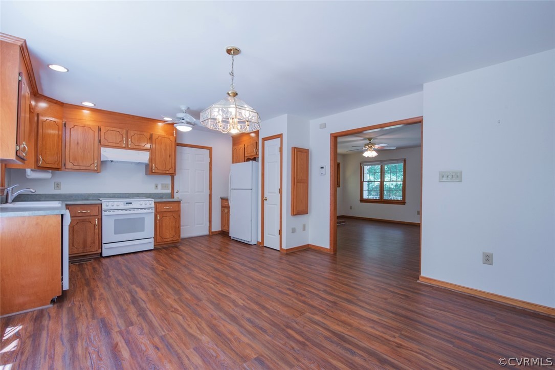 21417 Courthouse Road Dinwiddie, VA 23841 - Photo 15 of 50 a view of a kitchen with a sink cabinets and wooden floor