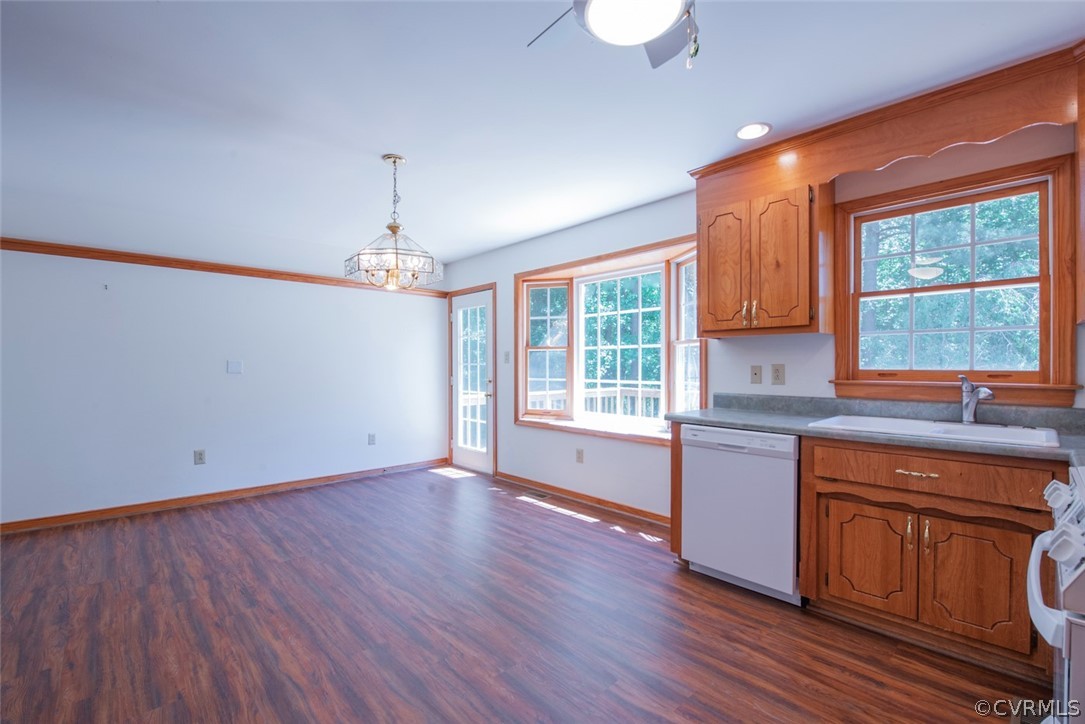 21417 Courthouse Road Dinwiddie, VA 23841 - Photo 19 of 50 a kitchen that has a sink wooden floor window and cabinets