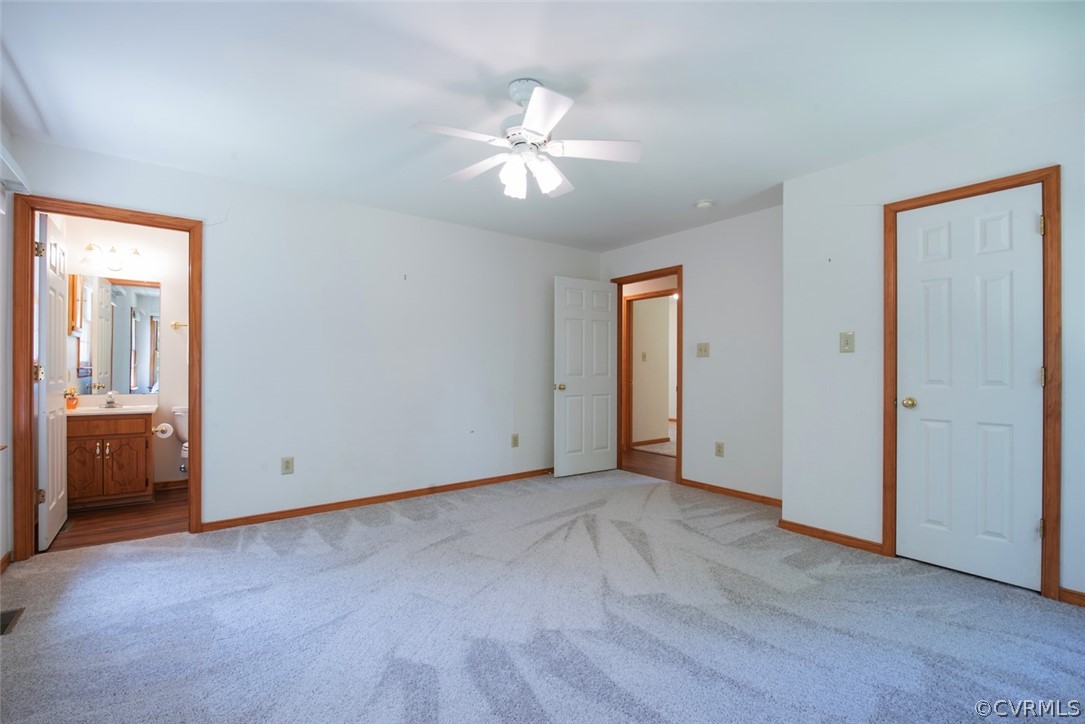 21417 Courthouse Road Dinwiddie, VA 23841 - Photo 35 of 50 an empty room with closet and a chandelier fan