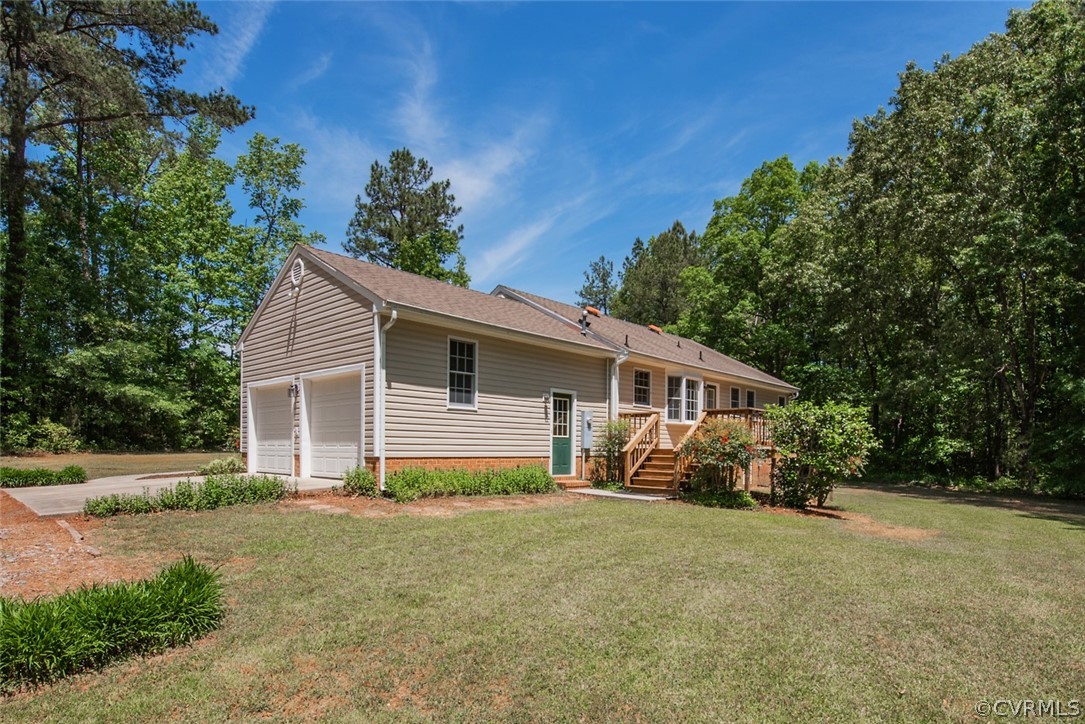 21417 Courthouse Road Dinwiddie, VA 23841 - Photo 46 of 50 a view of a house with a yard and plants