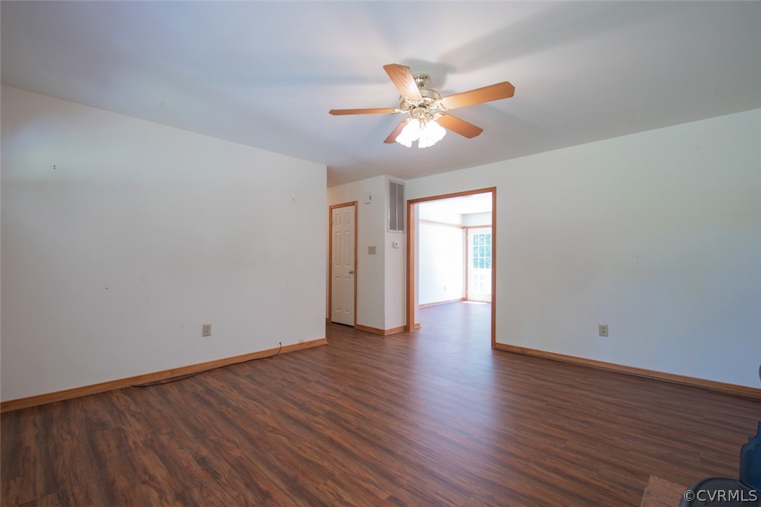 21417 Courthouse Road Dinwiddie, VA 23841 - Photo 8 of 50 a view of an empty room with wooden floor and window