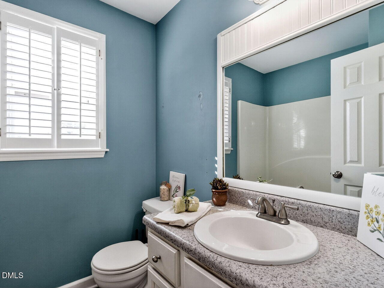 4500 Rivershyre Way Raleigh, NC 27616 - Photo 33 of 42 a bathroom with a toilet a sink and mirror