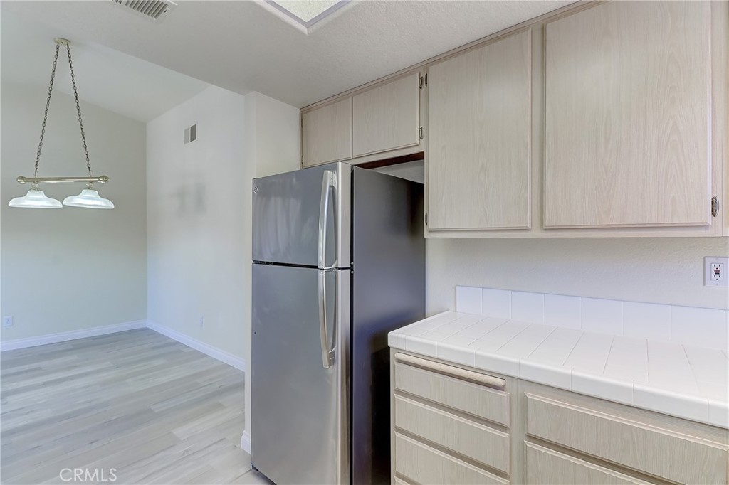 68 Abrigo Rancho Santa Margarita, CA 92688 - Photo 18 of 70 a kitchen with cabinets and stainless steel appliances