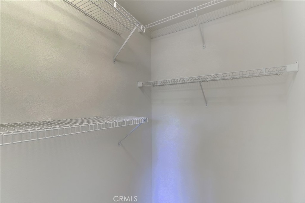 68 Abrigo Rancho Santa Margarita, CA 92688 - Photo 21 of 70 a view of a room with racks on the wall