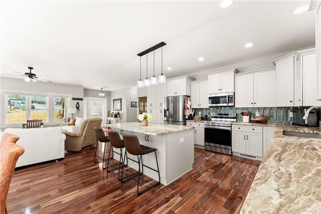 434 Riverbend Lane Bogart, GA 30622 - Photo 12 of 62 a open kitchen with white cabinets and stainless steel appliances