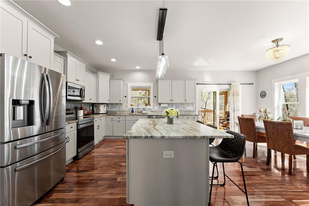 434 Riverbend Lane Bogart, GA 30622 - Photo 14 of 62 a large kitchen with granite countertop lots of counter space a refrigerator and furniture