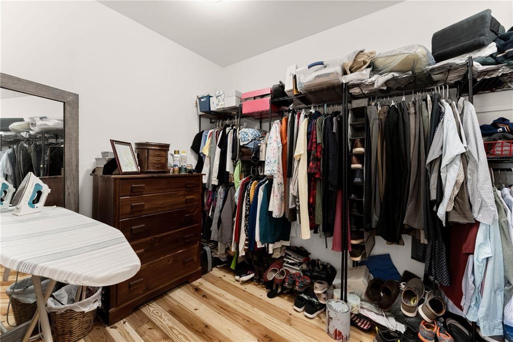 434 Riverbend Lane Bogart, GA 30622 - Photo 19 of 62 a view of walk in closet with clothes and shoes