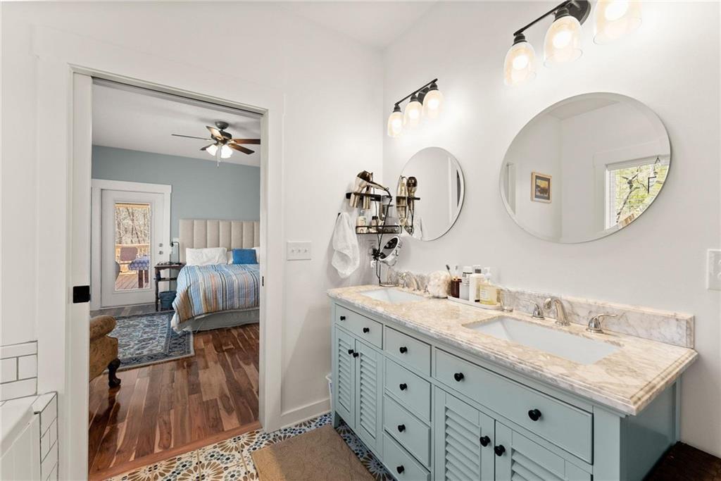 434 Riverbend Lane Bogart, GA 30622 - Photo 20 of 62 a en suite bathroom with a granite countertop sink and a mirror