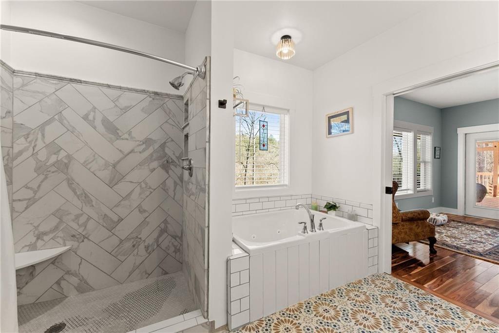 434 Riverbend Lane Bogart, GA 30622 - Photo 21 of 62 a bathroom with a bathtub and a shower