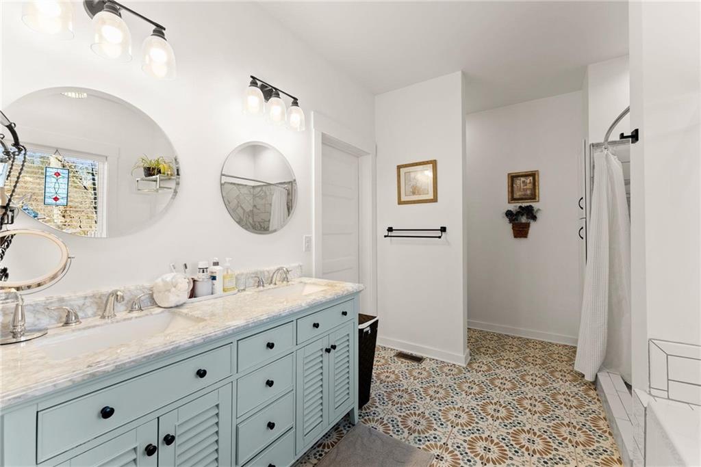 434 Riverbend Lane Bogart, GA 30622 - Photo 23 of 62 a bathroom with a granite countertop sink and a mirror