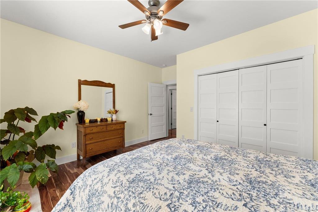434 Riverbend Lane Bogart, GA 30622 - Photo 49 of 62 a bed room with a bed and a chandelier