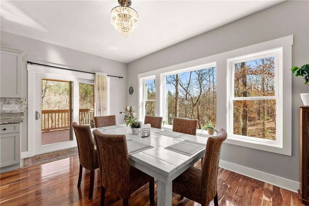 434 Riverbend Lane Bogart, GA 30622 - Photo 10 of 62 a view of a dining room with furniture window and wooden floor