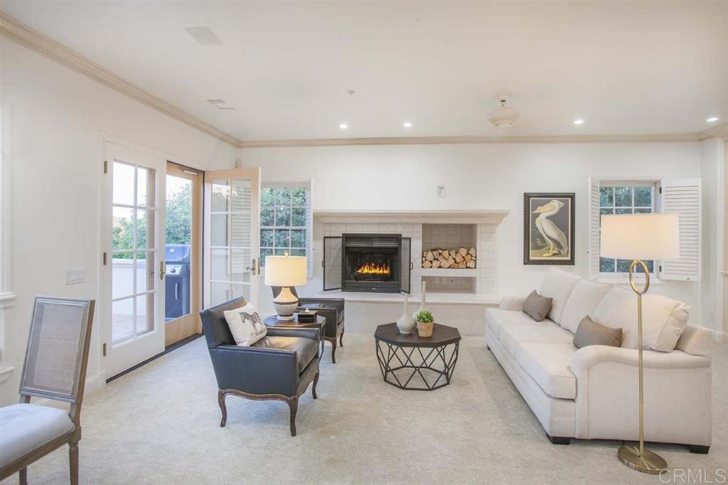 6019 La Flecha Rancho Santa Fe, CA 92067 - Photo 11 of 25 a living room with furniture and a fireplace