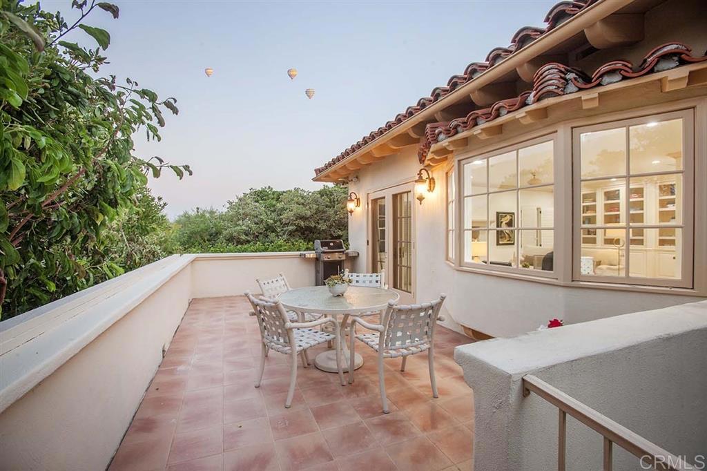 6019 La Flecha Rancho Santa Fe, CA 92067 - Photo 12 of 25 a view of a patio with table and chairs and potted plants