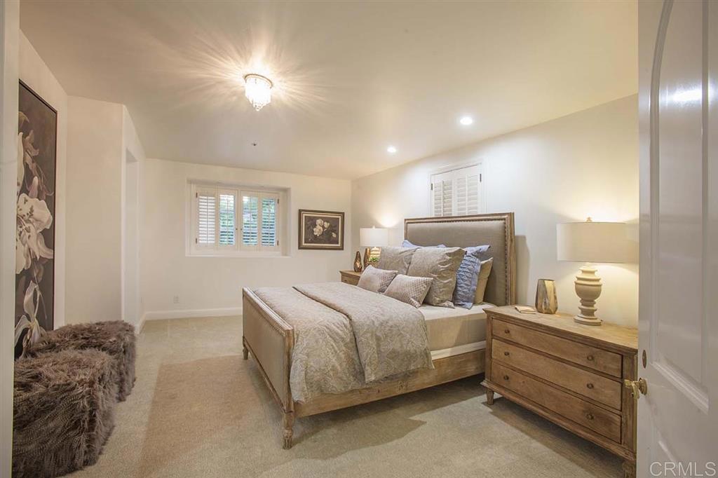 6019 La Flecha Rancho Santa Fe, CA 92067 - Photo 14 of 25 a bed room with a bed and a night stand