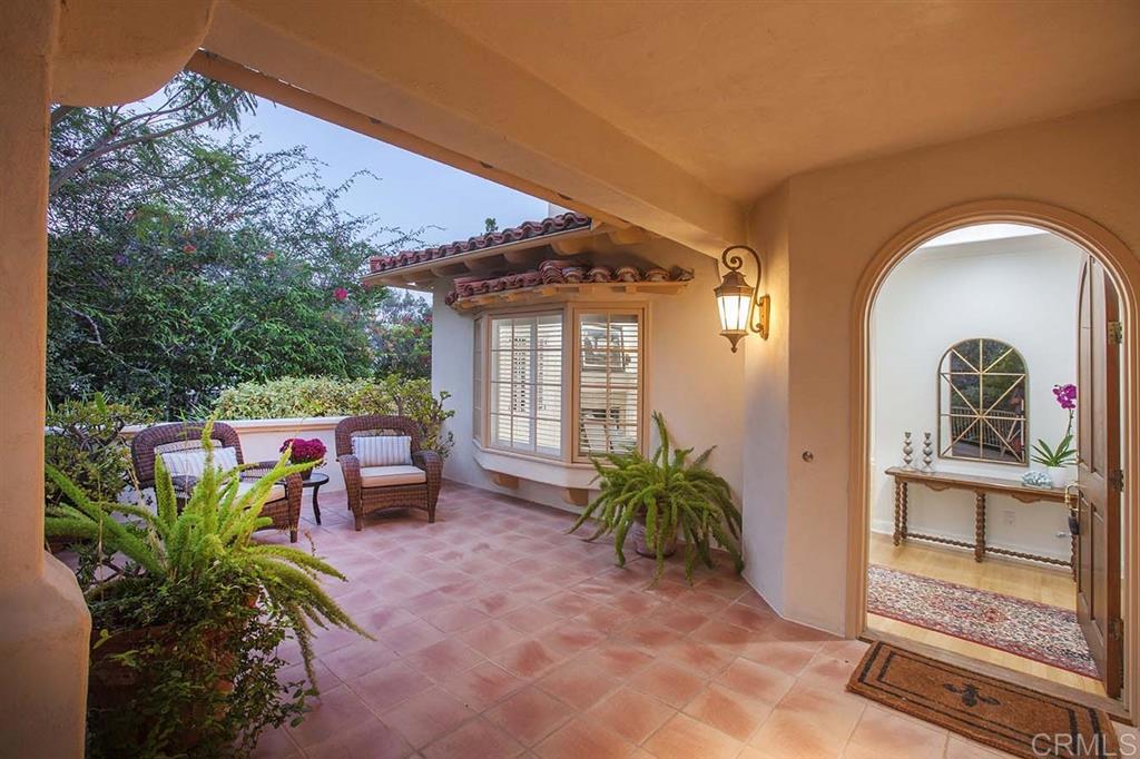 6019 La Flecha Rancho Santa Fe, CA 92067 - Photo 3 of 25 a view of a porch with chairs and potted plants