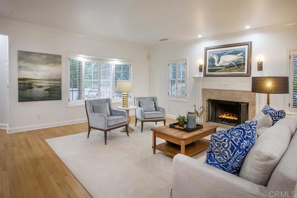 6019 La Flecha Rancho Santa Fe, CA 92067 - Photo 5 of 25 a living room with furniture and a fireplace