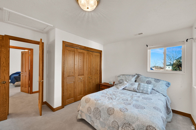 1085 Windsor Drive Provo, UT 84604 - Photo 50 of 83 Bedroom featuring light colored carpet, a closet, and attic access