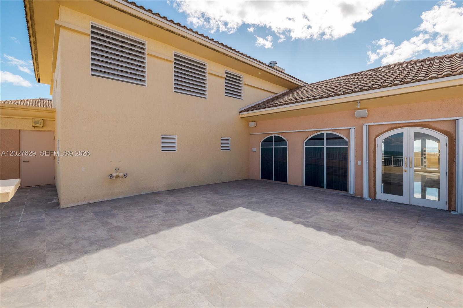 799 Crandon Boulevard, Unit PH8 Key Biscayne, FL 33149 - Photo 33 of 47 a view of a house with a garage