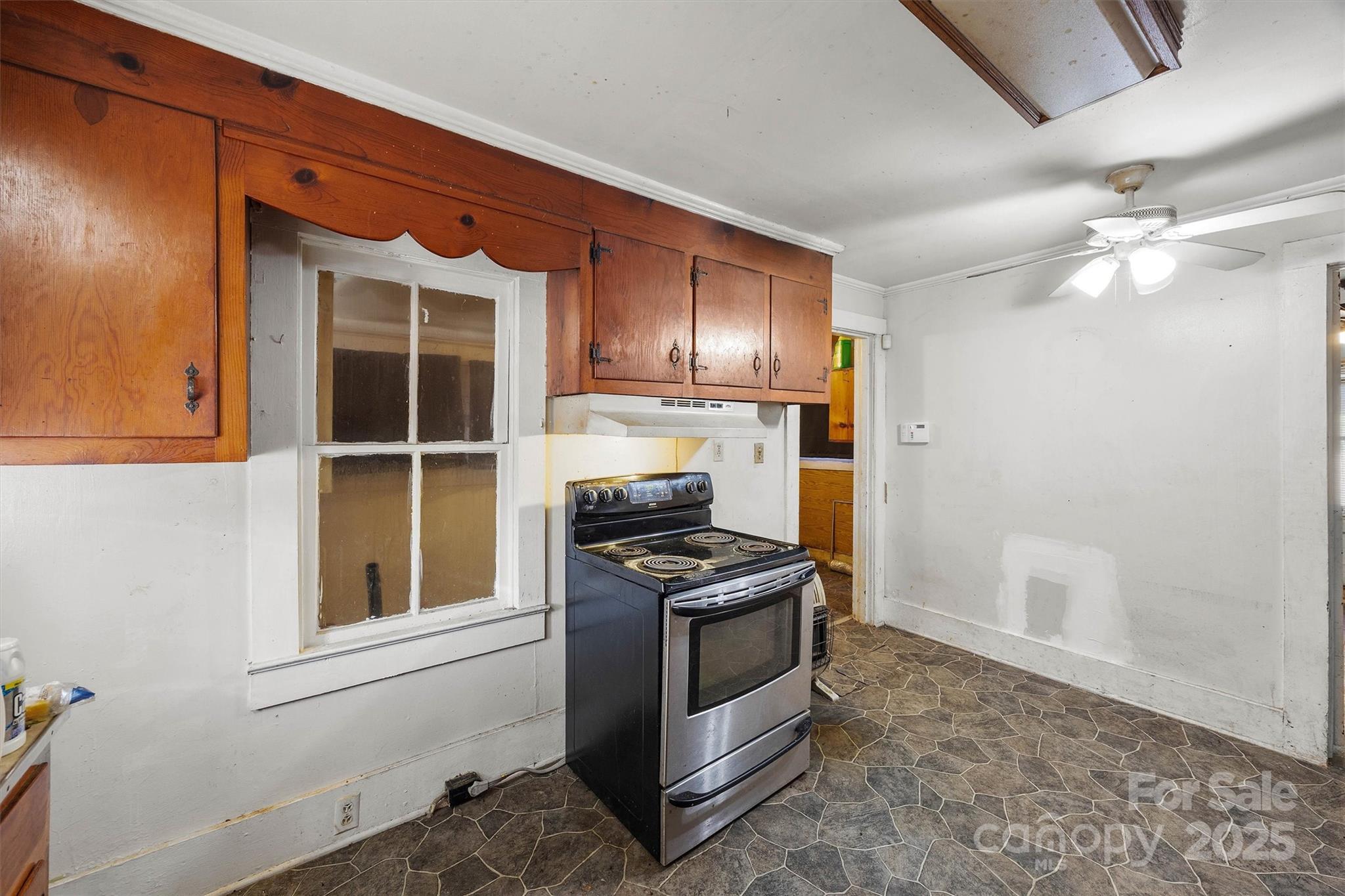 2012 State Road 30 Chester, SC 29706 - Photo 13 of 35 a kitchen with granite countertop a stove and a refrigerator