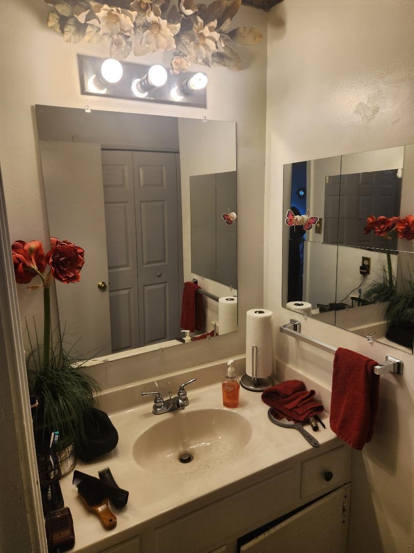 747 Best Street Covington, TN 38019 - Photo 7 of 15 Bathroom vanity featuring a single basin, chrome faucet, and integrated countertop
