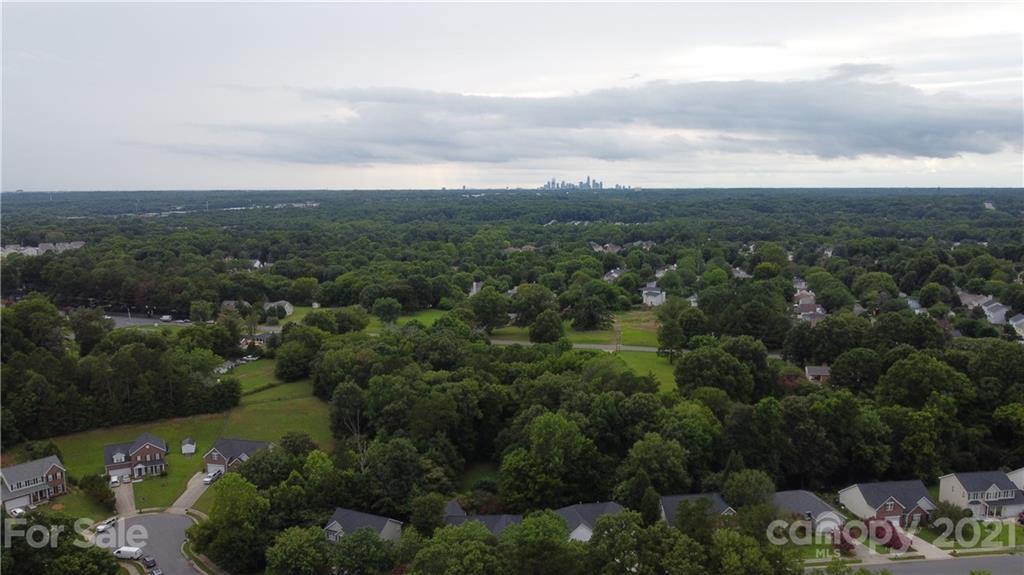 3305 Dion Drive Matthews, NC 28105 - Photo 3 of 3 an aerial view of a city and mountain