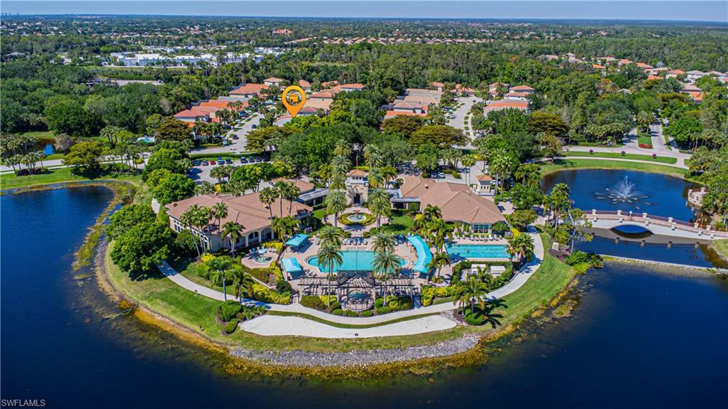 1364 Triandra Lane Naples, FL 34119 - Photo 14 of 27 a view of a swimming pool with a yard