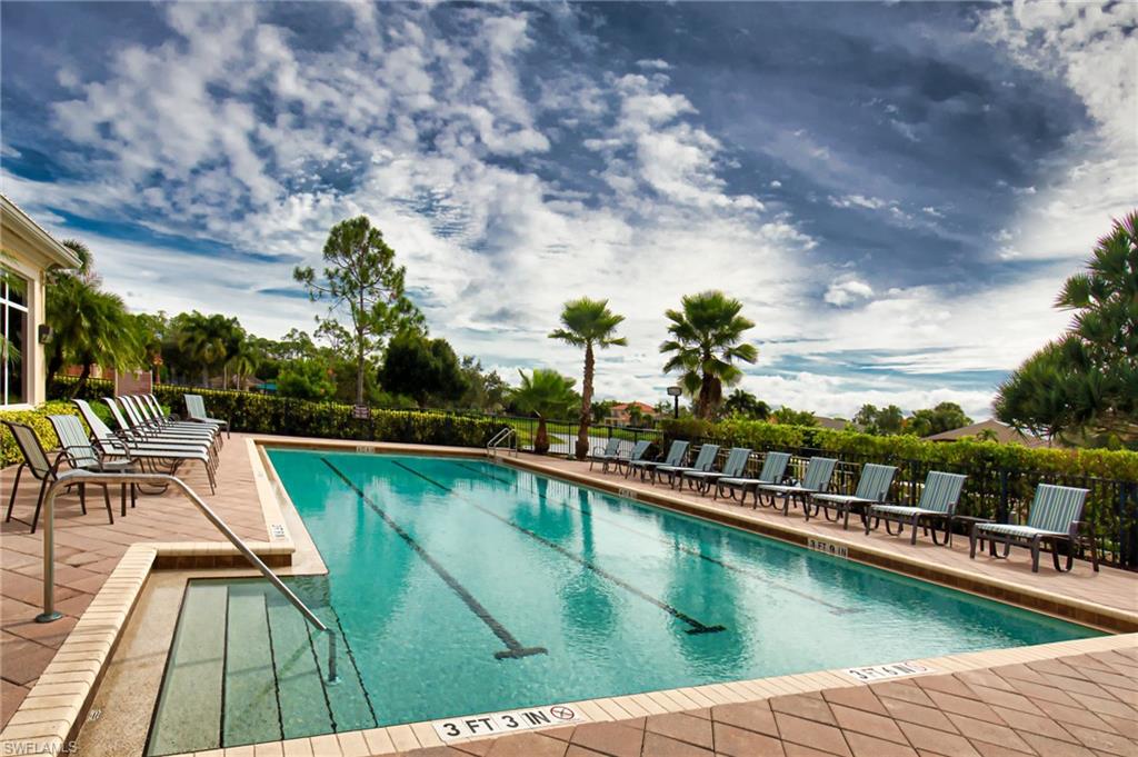 1364 Triandra Lane Naples, FL 34119 - Photo 15 of 27 a view of swimming pool with seating space