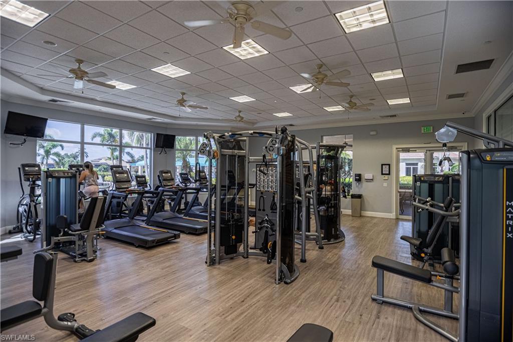 1364 Triandra Lane Naples, FL 34119 - Photo 18 of 27 a view of a room with gym equipment